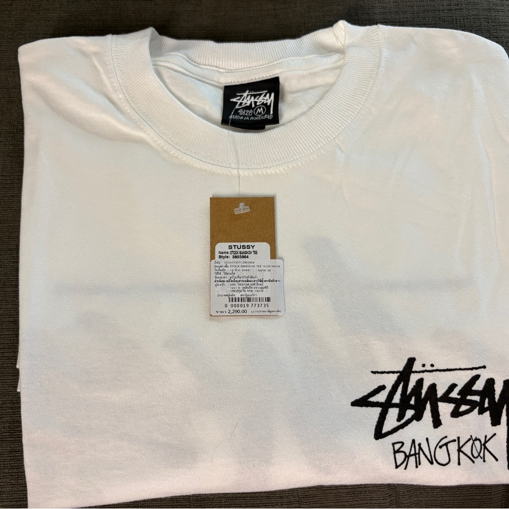 Stussy White Graphic Tee with Bangkok Logo